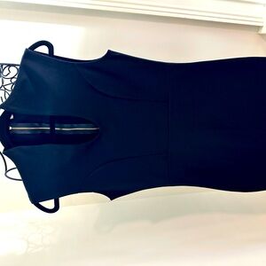 Woman’s below knee LBD black dress